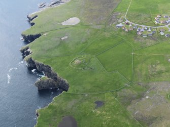 Oblique aerial view centred on the broch at Dalsetter, taken from the NE.