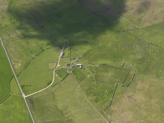 Oblique aerial view of Clumlie broch and township, looking to the SSW.