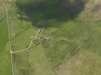 Oblique aerial view of Clumlie broch and township, looking to the S.