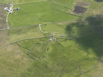 Oblique aerial view of Clumlie broch and township, looking to the E.