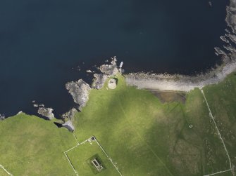 Oblique aerial view centred on the Broch of Mousa with The Haa adjacent, taken from the SE.