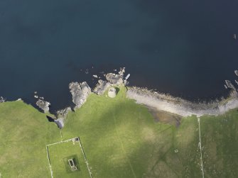 Oblique aerial view centred on the Broch of Mousa with The Haa adjacent, taken from the ESE.