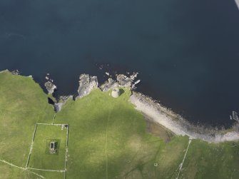 Oblique aerial view centred on the Broch of Mousa with The Haa adjacent, taken from the E.