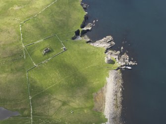 Oblique aerial view centred on the Broch of Mousa with The Haa adjacent, taken from the NNE.