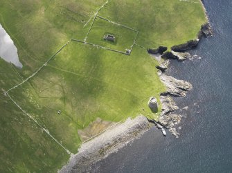 Oblique aerial view centred on the Broch of Mousa with The Haa and the burnt mound adjacent, taken from the NNW.