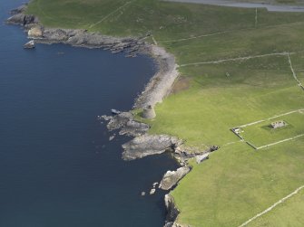 Oblique aerial view centred on the Broch of Mousa with The Haa adjacent, taken from the S.