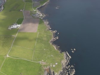 General oblique aerial view of the coast battery on Ness of Sound, looking to the NNW.