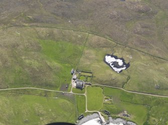 Oblique aerial view of Vaila House and the burnt mounds, looking SSE.
