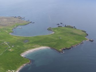 Oblique aerial view of Housa Voe and Kirk Sand, Papa Stour, looking NE.