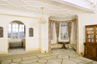 Interior. View looking into the south west corner of the main drawing room, including screen to jettied boudoir and corner turret