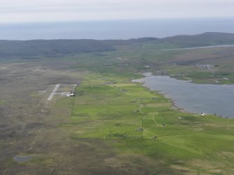 General oblique aerial view of Unst Airport, Ordale township and Balta Sound, looking WNW.
