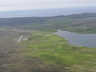 General oblique aerial view of Unst Airport, Ordale township and Balta Sound, looking WNW.