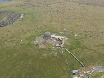 Oblique aerial view of the Saxa Vord radar station and the cairns, looking E.