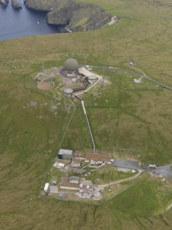 Oblique aerial view of the Saxa Vord radar station and the cairns, looking E.