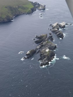 Oblique aerial view of North Unst Lighthouse, Muckle Flugga, looking SSW.