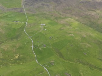 General oblique aerial view of the farmsteads, looking S.