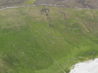 Oblique aerial view of the farmsteads and field systems at Sandwick, looking W.