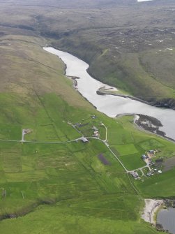 Oblique aerial view of Gloup with Gloup Voe beyond, looking SW.