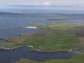 General oblique aerial view looking across Gloup, Breckton and Papil Ness on Yell, across the Bluemull Sound towards Wick on Unst in the distance, taken from the W.