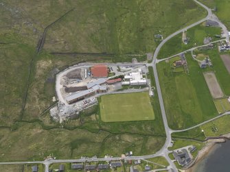 Oblique aerial view of Mid Yell Junior High School, looking W.