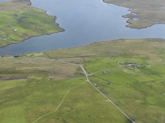 General oblique aerial view of West Houlland with Gruting and Scutta Voe beyond, looking SSE.