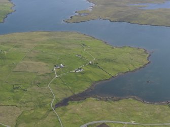 General oblique aerial view of West Houlland with Gruting Voe eyond, looking SSW.