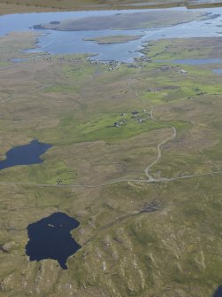General oblique aerial view of Brunatwatt and Walls with Linga, the Vaila Sound and Vaila beyond, looking SSW.