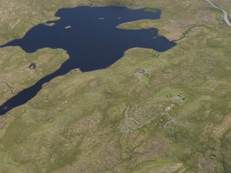 Oblique aerial view of the field systems, clearance cairns, cairns, buildings and other structures in the Loch of Flatpunds and Trolligarts area, looking S.