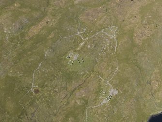 Oblique aerial view centred on the remains of the field systems, clearance cairns, heel-shaped cairn, buildings and enclosures at Flatpunds, looking NNE.