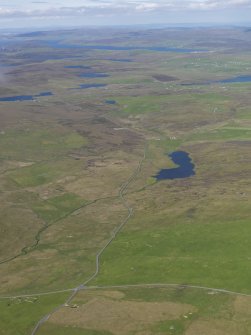 General oblique aerial view of Stanydale and the Loch of Gruting, looking NE.