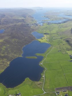 General oblique aerial view of the Loch of Tingwall with the Law Ting Holm in the foreground and Scalloway in the distance, looking SSW.