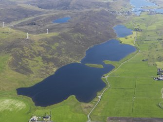 General oblique aerial view of the Loch of Tingwall with the Law Ting Holm in the foreground and Scalloway in the distance, looking S.