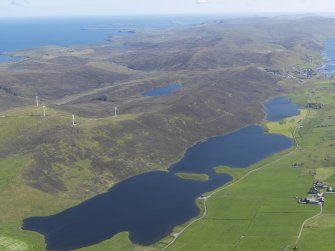 eneral oblique aerial view of the Loch of Tingwall with the Law Ting Holm in the foreground and Scalloway in the distance, looking S.