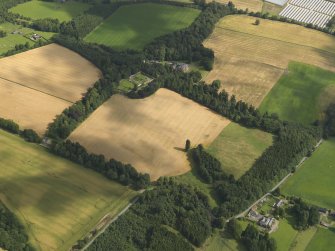 General oblique aerial view of the cropmarks of the rig with Balhary country house adjacent, taken from the SSW.