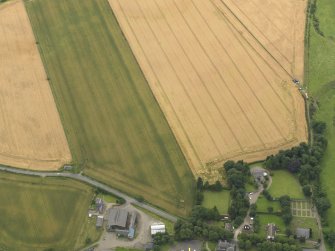 Oblique aerial view of the cropmarks of the square barrow cemetery, taken from the NNW.