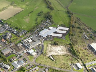 Oblique aerial view centred on the newly constructed Biggar High School, taken from the NW.