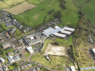 Oblique aerial view centred on the newly constructed Biggar High School, taken from the WNW.