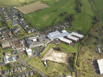 Oblique aerial view centred on the newly constructed Biggar High School, taken from the W.