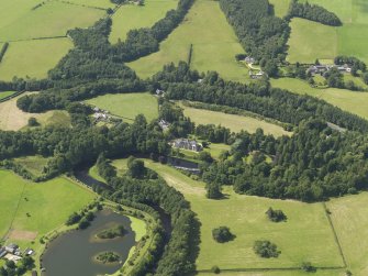 General oblique aerial view of Auchendrane Castlel, taken from the ESE.