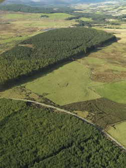 General oblique aerial view looking across the remains of Elsie the Greater Recumbent Stone Circle, taken from the NE.