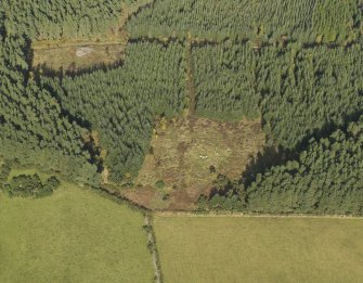 Oblique aerial view of the remains of Clune Wood Recumbent Stone Circle, taken from the S.