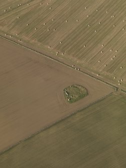 Oblique aerial view of the remains of Balquhain Recumbent Stone Circle, taken from the SE.