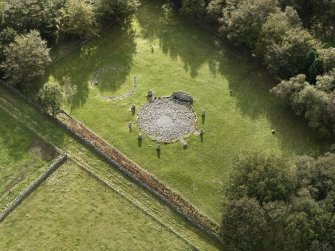 Oblique aerial view of the remains of the recumbent stone circle and enclosed cremation cemetery at Loanhead of Daviot, taken from the N.