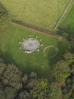 Oblique aerial view of the remains of the recumbent stone circle and enclosed cremation cemetery at Loanhead of Daviot, taken from the S.
