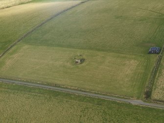 Oblique aerial view of the remains of the recumbent stone circle at Kirkton of Bourtie, taken from the SSE.