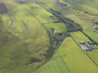 Oblique aerial view centred on Binscarth House with Howe Harper cairn in the foreground, taken from the NW.