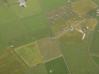 Oblique aerial view centred on the cropmarks of the possible enclosure, taken from the SE.