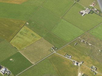 Oblique aerial view centred on the cropmarks of the possible enclosure, taken from the ENE.