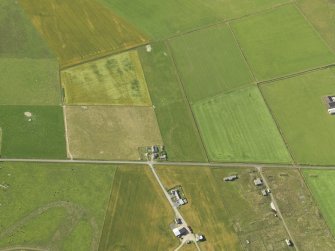 Oblique aerial view centred on the cropmarks of the possible enclosure, taken from the NNE.