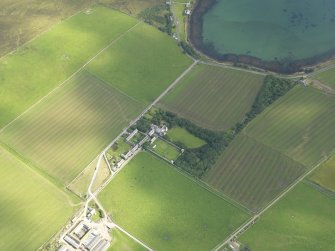 Oblique aerial view centred on Melsetter House with Melsetter farmstead adjacent, taken from the SW.
